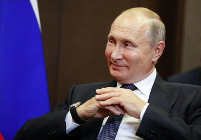 Vladimir Putin holding his hands.